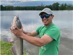 View larger image of A man holding a large fish at COOKS LAKE RV RESORT  CAMPGROUND image #4