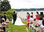 View larger image of A couple having a wedding by the water at COOKS LAKE RV RESORT  CAMPGROUND image #12
