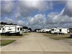 View larger image of A line of paved RV sites at CORRAL RV RESORT image #7