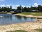 A view of the pavilion across the lake at THOMPSON LAKE RV RESORT - thumbnail