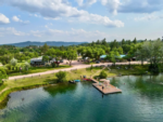 Aerial view of lake and sites at Hidden Lake Campground & Resort - thumbnail