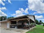 Pavilion with picnic tables at OUTPOST RV PARK & CAMPGROUND - thumbnail
