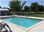 View larger image of Chairs around the swimming pool at STINSON RV PARK image #5