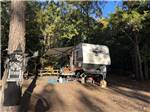 A travel trailer parked in a gravel site at LAKE THURMOND RV PARK - thumbnail