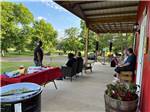 People sitting by the office at LAKE THURMOND RV PARK - thumbnail