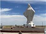 The front view of a giant statue of Jesus at PINE BLUFFS RV RESORT BY RJOURNEY - thumbnail