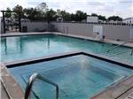 A view of the hot tub and swimming pool at ERIC & JAY'S RV RESORT - thumbnail