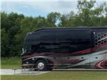 A conversion bus in a RV site at ASHLAND RV CAMPGROUND - thumbnail