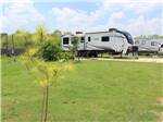 Trailers parked in gravel sites at CREEKSIDE RV RANCH - thumbnail
