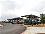 A row of covered paved sites at Jetstream RV Resort at Stone Oak Ranch - thumbnail