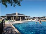 Guest enjoying the swimming pool at Jetstream RV Resort at Stone Oak Ranch - thumbnail