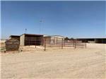 The stables and sign to the equine center at CLOVIS POINT RV STABLES & STORAGE - thumbnail