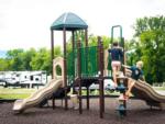 Kids playing at playground at PIGEON FORGE LANDING RV RESORT - thumbnail