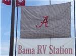 Business name and Alabama logo on a flag at BAMA RV STATION - thumbnail