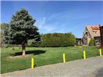 View larger image of A grassy area next to the main building at ELLENSBURG KOA JOURNEY image #3