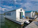 A row of rental house boats at FOUR CORNERS RV RESORT - thumbnail