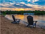 Two chairs overlooking the water at FOUR CORNERS RV RESORT - thumbnail