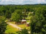 Aerial view of cabins among trees at TALLADEGA PIT STOP RV PARK & CAMPGROUND - thumbnail