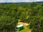 Aerial view of a cabin among trees at TALLADEGA PIT STOP RV PARK & CAMPGROUND - thumbnail