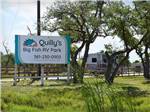 View larger image of The front entrance sign at QUILLYS BIG FISH RV PARK image #7