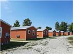 View larger image of Row of cabins down a road at MOUNTAIN TOP RETREAT CABINS  CAMPGROUND image #3