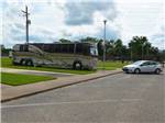A bus conversion on a paved RV site at MINEOLA CIVIC CENTER & RV PARK - thumbnail