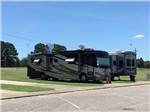A couple of RVs in paved RV sites at MINEOLA CIVIC CENTER & RV PARK - thumbnail