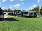 A fifth wheel trailer in a paved RV site at BEAUMONT RV & MARINA - thumbnail
