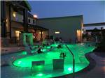 View larger image of The swimming pool at night at LAKESHORE RV RESORT image #6