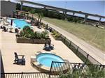 View larger image of The hot tub and swimming pool at LAKESHORE RV RESORT image #9