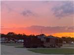 View larger image of Golden Sunset on park horizon at BANDERA CROSSING RIVERFRONT RV PARK image #9