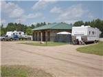 View larger image of RVs parked near main building at EVERGREEN PARK  CAMPGROUND image #3