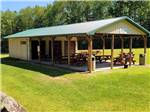 A pavilion with picnic tables at EVERGREEN PARK & CAMPGROUND - thumbnail