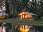 View larger image of A row of glamping cabins on the water at SANKOTY LAKES image #4