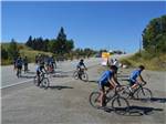 Several bicyclists in blue shirts and black shorts at SUMMIT RV RESORT - thumbnail