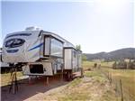 View larger image of A Cherokee travel trailer in a gravel site at SUNRISE RIDGE CAMPGROUND image #10