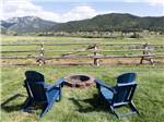 Two chairs set up near a fire pit ALPINE VALLEY RV RESORT - thumbnail
