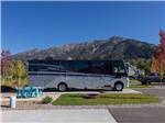 A large motorhome parked on-site at ALPINE VALLEY RV RESORT - thumbnail