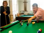 View larger image of A couple ladies playing pool at LEISURE WORLD RV RESORT image #5