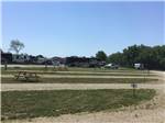 View larger image of Empty RV sites with picnic tables at CROWS NEST RV RESORT image #3