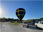 View larger image of Hot air balloon on the ground in RV campground at CROWS NEST RV RESORT image #9