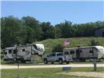 Fifth-wheel at campsite near gentle hill at CROWS NEST RV RESORT - thumbnail