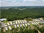 View larger image of An aerial view of the clubhouse and RV sites at WHISPERING PINES RV RESORT EAST AND WEST image #2