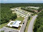 Aerial view of the office, swimming pool and sites at Whispering Pines RV Resort East and West - thumbnail