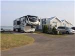 A fifth wheel trailer parked next to the model homes at BAYFRONT RESORT AT CROSS VIEW - thumbnail