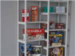 Board games on a rack in the rec room at BAYFRONT RESORT AT CROSS VIEW - thumbnail