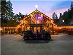 View larger image of A golf cart in front of the main building at WHISTLIN JACKS OUTPOST LODGE image #1