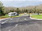 A paved road to the RV sites at WHISPERING FALLS RV PARK AND STORE - thumbnail