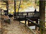 A wooden overlook at the river at WHISPERING FALLS RV PARK AND STORE - thumbnail