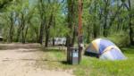A tent and trailer at sites - thumbnail